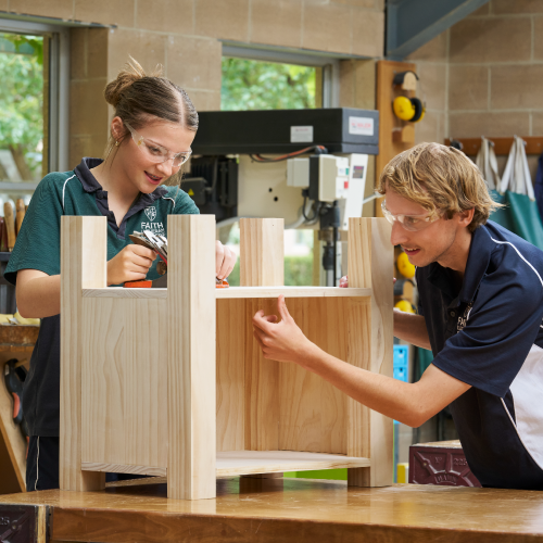 Two Faith Lutheran College students building a woodworking project